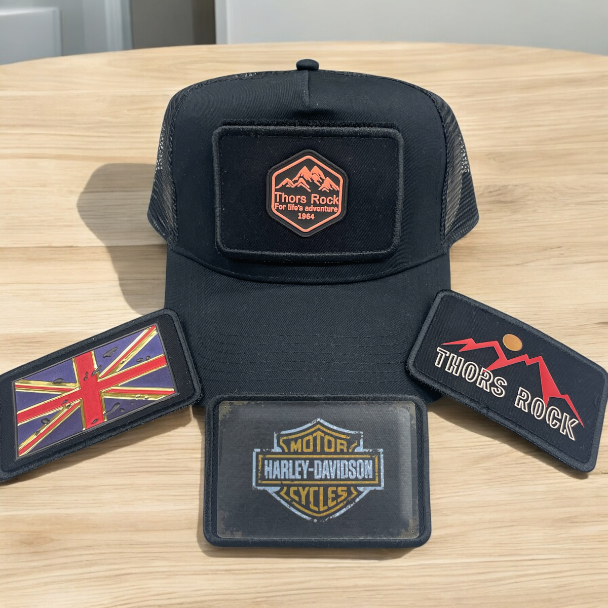 BLACK SNAPBACK TRUCKER HAT WITH PATCHES