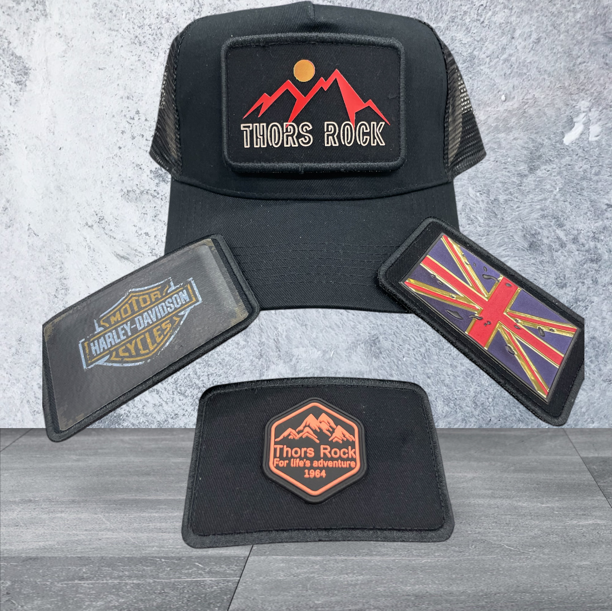 BLACK SNAPBACK TRUCKER HAT WITH PATCHES