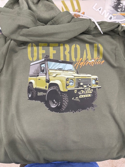 Green hoodie with off-road vehicle graphic and text on a surface