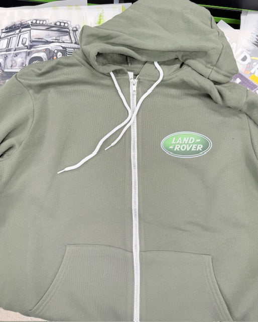 Green hoodie with Land Rover logo on a surface